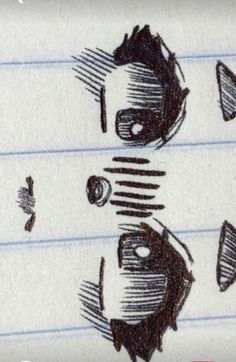 an image of three faces drawn on lined paper