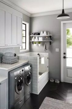 a washer and dryer in a small room