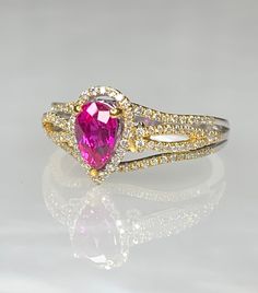 Ruby Ring, Ruby Diamond Ring For Women, Pear Shaped Ruby Engagement Ring, Pear Shaped Ruby Ring, Gemstone Engagement Ring, OOAK Ruby Ring A graceful and delicate pear shaped ruby ring featuring a bright and vibrant center stone weighing 0.96 carats accented by 0.76 carats of diamonds white intricately detailed and set in 14k two toned solid gold. *Approximate right weight: 3.13 grams * Ring size: US 6 1/2 * Complimentary resizing is available up to 3 sizes larger or smaller than stated size. Pink Pear-shaped Gemstone Rings, Teardrop Halo Ring In Fine Jewelry Style, Fine Jewelry Teardrop Halo Ring, Fine Jewelry Teardrop Ring With Accent Stones, Pink Teardrop Fine Jewelry Ring, Pear Shaped Pink Ring For Formal Occasions, Pink Pear-shaped Ring For Formal Occasions, Pink Pear-shaped Formal Rings, Formal Pink Pear-shaped Rings