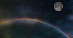 a full moon and a rainbow in the sky