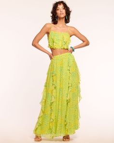 Lean into the power of flowers with the Paola. This flowing maxi skirt embraces the spirit of spring with the garden ditsy print, and whether paired with the matching Linzi Top or favorite tank, your look will bloom with every wear of the Paola.This style is sold exclusively at Ramy Brook. Size & Fit – This style runs small, we suggest sizing up. – Model is Wearing Size 0 – Model is 5'9" Size Guide Details & Care – Style Exclusive– Lined– High-waisted – Ruffles down the length – Zipper closure in back– Dry Clean or Hand Wash– Style #: A04246006– 100% Viscose – Lining: 100% Polyester Free Delivery & Easy Returns We offer free ground shipping on all U.S. orders and easy returns within 30 days on all eligible merchandise. See more details here. Ruffle Maxi Skirt, Swimsuit Cover Up Dress, Ditsy Print, Ramy Brook, Wardrobe Edit, Spring Wardrobe, Kids Sweater, Cover Up Dress, Denim Jumpsuit