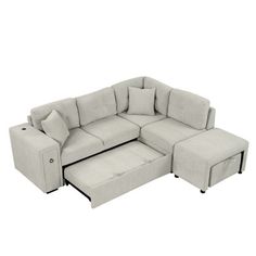 the sectional sofa with ottoman and footstool is shown in light gray linens