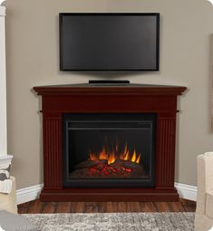 a flat screen tv mounted above a fire place