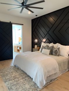 a large bed sitting in a bedroom on top of a hard wood floor