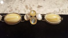 This is a very pretty costume jewelry bracelet. This piece would be perfect for every day or a night out. The colors are a soft creamy yellow stone and other like hues. This piece is in excellent vintage condition and is perfect for your spring and summer wardrobe. This bracelet would also make a great Mother's day gift! Vintage Beige Bracelet, Adjustable Beige Bracelet For Formal Occasions, Vintage Cream Bangle Jewelry, Cream Vintage Bangle Jewelry, Vintage Cream Bracelet, Pretty Costume, Wedding Jewelry Bracelets, Yellow Stone, Jewelry Bracelet