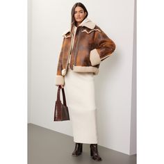 Brown faux leather (100% Polyester). Jacket. Long sleeves. Collar. Front zipper closure. 25" from shoulder to hemline. Imported. Chic Leather Jacket With Padded Collar, Chic Cropped Jacket With Faux Fur Trim, Fall Workwear Leather Jacket With Zip Cuffs, Leather Jacket With Zip Cuffs For Work In Fall, Leather Cropped Jacket With Zipper Closure, Fall Leather Jacket With Zipper For Work, Fall Leather Jacket With Zip Cuffs For Work, Fitted Leather Jacket With Zip Cuffs For Fall, Leather Cropped Jacket With Zipper For Work