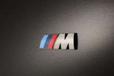 the bmw m logo is shown on a car