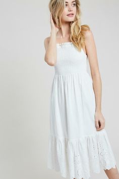 From beach days to a village stroll, all eyes will be on you in the adorable Summer Sun White Smocked Midi Dress! Adjustable tank straps top this sweet midi made from ivory white lightweight woven fabric. A square neckline and stretchy smocked bodice top a flowy midi skirt with an eyelet lace ruffle hem. DETAILS & CARE Cotton. Dry Clean. Imported. ORDERS, SHIPPING & RETURNS Orders, Shipping, & Returns Affordable White Smocked Dress, White Sun Dress Midi Boho, Cute White Smocked Dress Affordable, Cheap Sleeveless Smock Sundress, Affordable Smocked Sundress For Summer, Affordable Summer Midi Dress With Smocked Bodice, Cheap Sundress With Smocked Back For Brunch, Cheap White Sundress For Play, Luxury Fitted Smocked Midi Dress