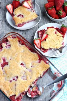 strawberry cobbler with fresh strawberries on the side and two plates full of it