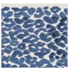 a blue and white rug with an animal print on it