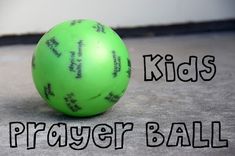 a green ball sitting on top of a floor next to the words kids prayer ball