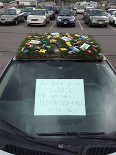 a car with a sign on the roof that says, you better have to go home coming in may