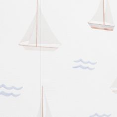 two sailboats floating on top of the ocean next to each other in front of a white background