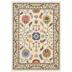 a white rug with colorful floral designs on it