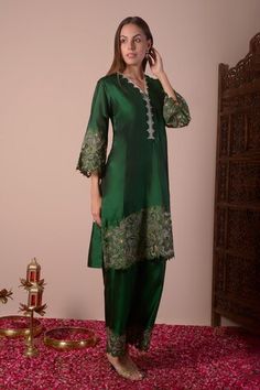 Emerald green kurta with floral cutwork embroidered border. Paired with palazzo. - Aza Fashions Semi-stitched Green Palazzo Set With Floral Embroidery, Elegant Green Kurta With Floral Embroidery, Green Silk Set With Floral Embroidery, Festive Green Lawn Suit With Cutdana, Elegant Green Sets With Floral Embroidery, Elegant Festive Traditional Wear With Cutwork, Green Silk Lawn Suit For Navratri, Festive Green Lawn Suit With Cutdana Embroidery, Festive Chanderi Cutwork Sets