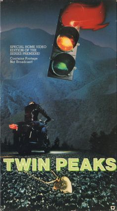 a book cover for twin peaks with a traffic light in the foreground and an image of a person on a motorcycle