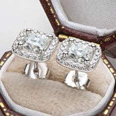 Earrings Information 
  


Metal: 
925 Sterling Silver 


Sku: 
EMO-023


Rhodium: 
Yes 


Nickle Free: 
Yes 


Gem Type: 
Moissanite


Stone Color: 
White


Center Stone Cut: 
Cushion Cut


Center Stone Weight: 
1.0ct*2pcs (6x6mm*2pcs)


Stone Setting: 
Prong Setting


Average Clarity: 
FL-IF 


Average Color: 
D-E 









LOOKS THE SAME AS DIAMOND (WITH NAKED EYES)
While diamonds are graded on the 4 C’s scale (Cut, Clarity, Color, Carat), AINUOSHI Moissanite® are not diamond, and are graded Silver Cushions, Halo Stud Earrings, Cushion Cut Moissanite, Luxury Earrings, Halo Earrings Studs, Moissanite Earrings, Stone Setting, Rose Gold Earrings, Sterling Silver Studs