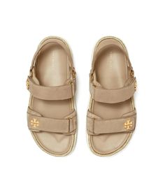 Experience the perfect blend of class and comfort wearing the Tory Burch® Kira Rope Sport Sandal. Crafted from leather upper, lining and insole, this pair of sandals features open round toe, slingback strap, dual hook-and-loop closure strap with brand detailing and brand name embossed on the footbed..Leather Working Group-certified tannery (LWG)..Rubber outsole..Imported..Product measurements were taken using size 7, width M. Please note that measurements may vary by size..Measurements: Weight: 1 lb 8 oz Luxury Summer Sandals With Textured Footbed, Luxury Open Toe Sandals With Textured Footbed, Designer Open Toe Sandals With Leather Footbed, Luxury Summer Footbed Sandals With Removable Insole, Luxury Slingback Sandals With Leather Footbed For Summer, Luxury Summer Slingback Sandals With Leather Footbed, Luxury Leather Footbed Slingback Sandals For Summer, Designer Sandals With Textured Footbed And Round Toe, Luxury Sport Sandals With Round Toe For Summer