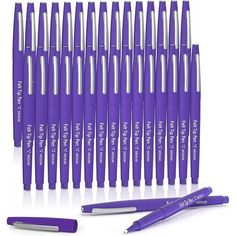 the purple pen is lined up next to each other and it's full of pens