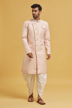 Peach sherwani with all over woven floral jaal pattern. Comes with dhoti pant.
Components: 2
Pattern: Woven
Type Of Work: Floral Jaal
Neckline: Mandarin Collar
Sleeve Type: Full
Fabric: Sherwani: Banarasi Zari Jacquard, Dhoti Pant: Silk Dupion
Color: Peach
Other Details: 
Closure: Sherwani: Button
Note: Pocket square worn by model is not for sale
Occasion: Mehendi and Puja,Sangeet - Aza Fashions Pink Sherwani For Diwali And Traditional Ceremonies, Pink Sherwani With Zari Work For Traditional Ceremonies, Pink Sherwani For Traditional Ceremonies And Eid, Pink Sherwani For Festive Traditional Ceremonies, Festive Pink Sherwani For Traditional Ceremonies, Pink Sherwani With Pallu For Traditional Ceremonies, Traditional Pink Sherwani For Diwali, Traditional Pink Sherwani For Navratri, Traditional Sherwani With Zari Weaving For Ceremonies