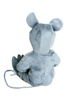 a gray stuffed animal sitting on top of a white floor