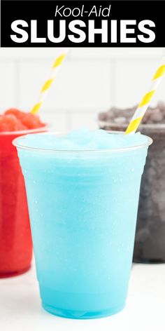 two drinks in plastic cups with straws next to each other on a white counter