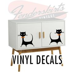 a white cabinet with black cats on it and the words vinyl decals above it