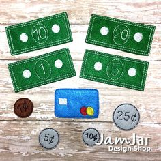 three felt numbers and one hundred dollar bill on a wooden table with green felt backing