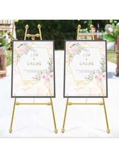 two eases with flowers on them sitting in the middle of a white and gold wedding ceremony