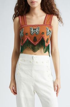 This stunning crop top is hand-embellished with fanciful butterfly beadwork and draped fringe inspired by a window valance. 17" length (size Small) Back hook-and-eye closure Square neck Lined Sleeveless 100% cotton Dry clean Imported Designer Clothing Diy Crop Top, Fringe Crop Top, Fringe Tank Top, Utility Shorts, Window Valance, Beaded Top, How To Make Clothes, Beaded Fringe, Cut Shirts