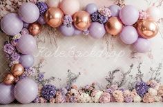 an image of balloons and flowers on the wall