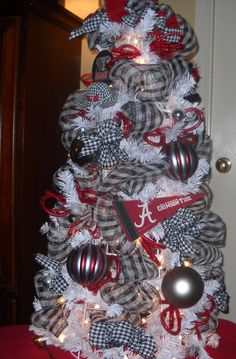 a christmas tree decorated with red, white and black ornaments