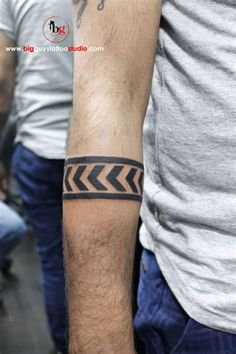 a man with a tattoo on his arm