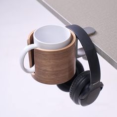 a coffee cup with headphones attached to it