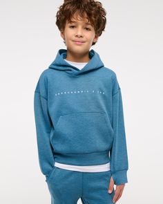 Comfy popover hoodie in our new neoknit active fabric, with 4-way stretch and sweat-wicking properties. Features print logo detail at chest, on-trend seaming details, front pouch pocket, banded hem and thumbholes at cuffs. Boys Tops, Abercrombie Kids, Boys Hoodies, Boys Top, Hoodie Top, Pullover Sweatshirts, Print Logo, Kids Design, Kids Boys