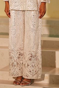 White flared pant with mirror jaal embroidery and cutwork detailing.
Components: 1
Pattern: Embroidery
Type Of Work: Mirror
Color: White
Other Details: 
Cutwork detailing
Note: Top worn by the model is not for sale
Occasion: Mehendi and Haldi - Aza Fashions Elegant Party Pants With Resham Embroidery, Elegant Pants With Intricate Embroidery For Festive Occasions, Glamorous Embellished Pants For Festive Occasions, Glamorous Embellished Pants For Festive Season, Glamorous Embellished Festive Pants, Festive Floor-length Party Bottoms, Elegant Embroidered Pants For Eid, Elegant Festive Wide-leg Sharara, Embellished Bottoms For Wedding