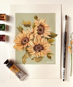 a painting of sunflowers on a green background next to some watercolor paints