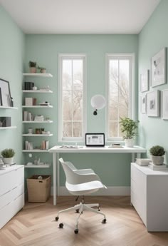 a home office with mint green walls and white furniture