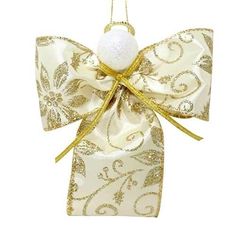 a white ornament with gold ribbon and bow