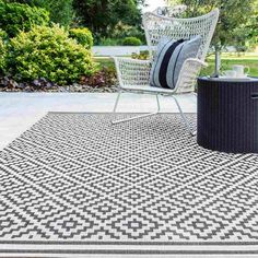 a black and white area rug on a patio