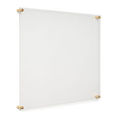 a white board with gold handles on it