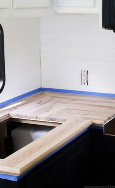 the kitchen counter top is being installed with blue tape