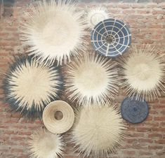 an overhead view of several hats on a brick wall