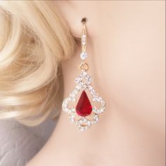 "Elegant Victorian inspired drop earrings, pendant, or necklace set with ruby red Swarovski crystal center jewels bordered by swirls of pave set clear diamante. The metal is nickel-free with your choice of rose gold, silver, or gold plating. The earrings are 2\" (5 cm) long and .8\" (2cm) wide. The pendant is 1.5\" long on a chain that is adjustable from 16\"-18\" long. Ships quickly in a free gift box! I stock Swarovski crystals in the full rainbow of colors and can customize this design in man Crystal Jewelry For Wedding And Valentine's Day, Rose Gold Teardrop Ruby Jewelry, Formal Red Dangle Jewelry Sets, Elegant Teardrop Jewelry For Valentine's Day, Rose Gold Ruby Jewelry For Parties, Red Crystal Jewelry With Matching Earrings, Red Rhinestone Jewelry Sets For Wedding, Wedding Jewelry With Matching Earrings In Red, Elegant Red Drop Crystal Earrings