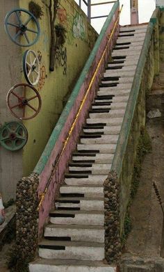 an old set of stairs with graffiti on the wall