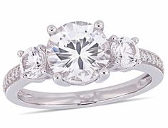 a three stone engagement ring with diamonds