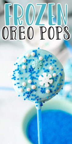 frozen oreo pops with blue frosting and sprinkles on the top