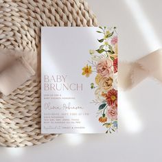 a baby brunch card with flowers on it