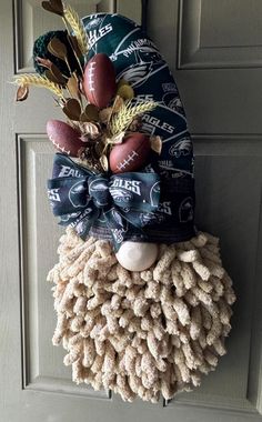 a wreath made to look like a sheep's head with footballs on it