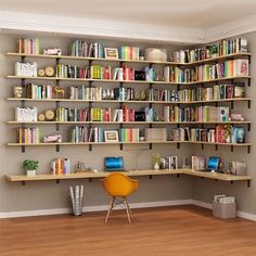 a room with bookshelves and chairs in it